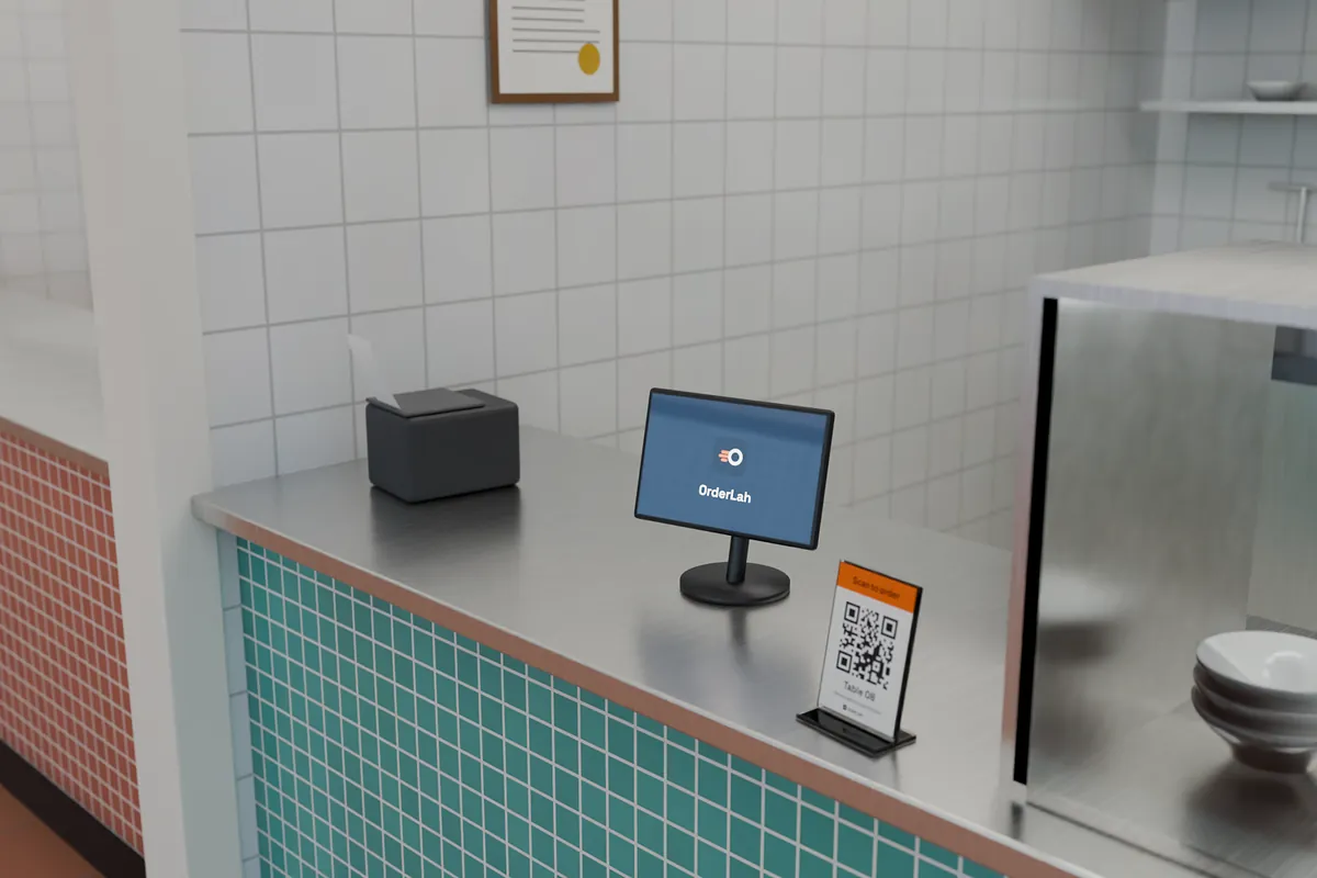 The hub: an Android tablet on a stand on the stall's stainless-steel counter, a receipt printer beside it with a ticket coming out, a “Scan to order” QR card in a stand next to them and the tiled kitchen behind.